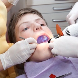little boy getting dental treatment